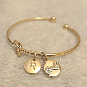 #359 Gold tone bracelet with letter R